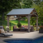Aoxun 10 x 12 cedar wood pavilion gazebo with gable metal roof, poolside, daytime