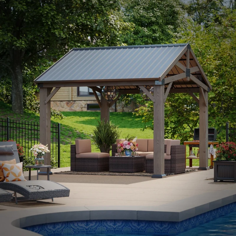 Aoxun 10 x 12 cedar wood pavilion gazebo with gable metal roof, poolside, daytime