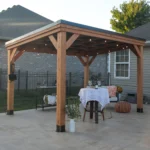 Backyard Discovery Arcadia 12x9.5 cedar gazebo with galvanized steel roof over a bistro table
