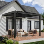 Evanston wall-mounted louvered pergola seen at an angle over a brick patio with seating